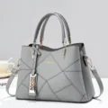 Borsa a mano grigia classica da donna, elegante borsa a tracolla con motivo geometrico moderno. - Grigio