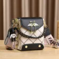 Women stylish small crossbody bag with diamond lattice pattern and cute swan pendant for daily use. - Black