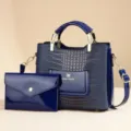 Dark blue patent leather handbag with crocodile texture and matching clutch pouch detail. - Royal Blue + Small Pouch
