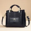 Black PU leather crocodile pattern women shoulder handbag with top handles and gold hardware. - Black