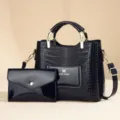 Elegant black patent leather handbag set with crocodile texture, top handle and shoulder strap. - Black With Small Bag