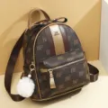 Stylish brown monogram travel backpack for women with bow and pompom charm daily use. - Large BE Style / Champagne