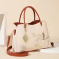 Elegant embroidered women handbag with top handle and stylish leaf pendant for daily wear. - Peony - Khaki