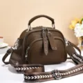 Stylish brown crossbody bag for women with wide strap and multi-pocket design for daily use. - Rivet Zipper / Coffee