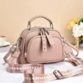 Stylish pink womens shoulder crossbody bag with wide strap and top handle for daily use - Rivet Zipper / Pink