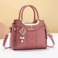 Pink women handbag elegant shoulder crossbody bag stylish top handle bag with metal charm - Stitched Style - Dusty Pink