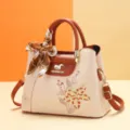 Beige leather handbag with brown handles, elegant floral embroidery and stylish scarf. - Squirrel Azalea - Khaki