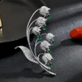Elegante broche de lirio de los valles con circonitas brillantes para abrigos y trajes. - Blanco Plateado