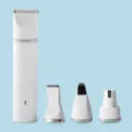White rechargeable pet hair trimmer set with multiple interchangeable grooming heads. - White 4-in-1 / White