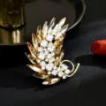 Elegant feather crystal brooch for women, sparkling rhinestone fashion suit pin accessory. - Feather / Gold