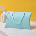 Light blue pillow gift box detail view, elegant paper packaging box with handle rope. - Light Blue Ingot-Shaped Jewelry Box