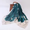 Elegant dark green silk square scarf with floral print draped on luxury leather handbag - Blue Plum Blossom Hole