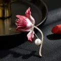 Elegant pink gradient iris flower brooch with sparkling zircon stem and pearl accessory. - Iris Flower Brooches / Pink Gradient