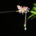 Traditional Chinese wooden hairpin featuring a pink butterfly and long gold tassel - Pink and White Butterfly Light Pink Tassel Style (2851)