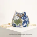 Embroidered sequin bucket bag with gold chain strap in blue flower pattern - Blue