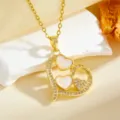 Gold double heart pendant necklace featuring sparkling zircons and delicate pink inner details. - White Shell Heart Necklace / Gold