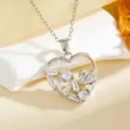 Close-up detail of the silver heart pendant necklace with sparkling zirconia and swan motif. - White Diamond Swan Heart Necklace / Silver