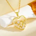 Detailed close-up of the elegant gold heart pendant featuring sparkling zirconia and crystal swan. - White Diamond Swan Heart Necklace / Gold