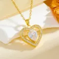 Gold heart pendant necklace detail shot featuring sparkling teardrop cubic zirconia stones. - Teardrop Heart Style (T014) / Gold White Rhinestone