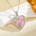 Elegant heart-shaped cubic zirconia pendant necklace with sparkling pink stone details. - Teardrop Heart Style (T014) / Silver Pink Stone