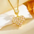 Close-up detail view of gold-tone double heart pendant necklace sparkling with cubic zirconia stones. - Fully Paved Heart With White Stones(T059) / Gold