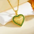 Close-up detail of a gold heart pendant necklace featuring sparkling green zirconia stones. - Solid Heart With Green Stone(T059) / Gold