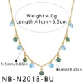 Elegant gold stainless steel chain necklace featuring blue crystal and green enamel flower charms. - Necklace / Blue