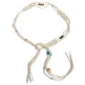 Boho braided rope belt detail showing intricate macrame knots, wooden beads, and chic tassels. - Beige