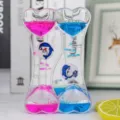 Clessidra liquida doppio cuore decorazione scrivania con gocce d'olio colorate e delfini. - Cuore delfino singolo