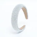 Close up of pearl and rhinestone headband, sparkling crystal hair hoop detail view. - Pearl