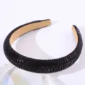 Detail view of black rhinestone padded headband sparkling crystal hair accessory for women. - Black