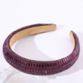 Detail shot of the purple rhinestone padded headband showing sparkling crystal texture and details. - Purple