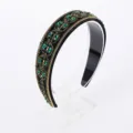 Exquisite Baroque rhinestone headband detail showcasing sparkling green crystals and gold trim. - Green