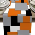 Camino de mesa geométrico moderno con bloques de color naranja gris blanco y negro decoración. - Naranja
