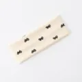 Fascia per capelli larga in maglia beige con fiocco, elastica e assorbente per lo sport. - Beige