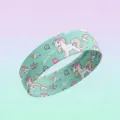 Vista di dettaglio della fascia per capelli in tessuto con stampa unicorno, stile dolce. - Unicorno Verde