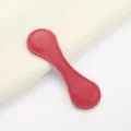 Red leather magnetic pants cuff clip clothing accessory for secure trouser hem styling fix. - Red