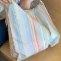 Mini foldable striped shopping bag, waterproof portable handbag for daily casual outdoor use. - Sweet Orange Beach