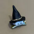 Closeup of cute cartoon witch hat hair clip with funny googly eyes, perfect for Halloween - Black Duckbill Clip