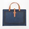 Blue leather briefcase with brown handles and buckle, ideal for business commuting. - Handheld Double-Pocket Document Bag / Blue
