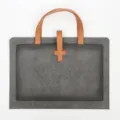Grey leather briefcase with brown handles and buckle, ideal for business commuting. - Handheld Double-Pocket Document Bag / Gray