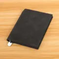 Black leather business notebook with ribbon bookmark for daily office work and study. - Black