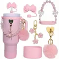 Pink tumbler accessories set including silicone boot, bow straw cover, and cute charm chains. - Pink