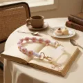 Handmade knitted floral cup strap with silicone ring and cute charms for water bottles. - White Ring + Pink Daisy Lanyard & Floral Pendant
