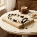 Handcrafted black and white daisy woven water bottle strap with silicone ring and cute charms. - Black Ring + Daisy Lanyard + Floral Pendant