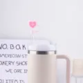 Pink silicone heart straw cover and insulated tumbler accessory for daily use and decor. - Straw Cap / Pink