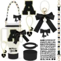 Detailed view of tumbler accessories set including silicone boot, straps, and letter charms. - Letter A