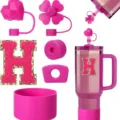 Pink tumbler accessory set including silicone boot, straw covers, and letter H patch. - Letter H