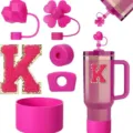 Pink tumbler accessory set featuring silicone boot, heart straw cover, and letter patch. - Letter K