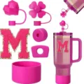 Pink tumbler accessories set including silicone straw covers, boot protector, and letter M patch. - M